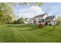 Expansive backyard with play structure at 14003 Grannan Ln, Carmel, IN 46074
