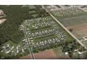 Aerial view of a Gathering-friendly neighborhood with beautiful homes, green spaces, and well-maintained streets at 15071 Garden Mist Pl, Fishers, IN 46040
