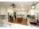 Stylish kitchen with granite countertops, stainless steel appliances, and a central island at 15203 Shoreway Ct, Carmel, IN 46032