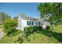 Side view of a classic home, featuring well-kept greenery and vintage charm at 1932 Central Ave, Columbus, IN 47201