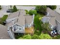 Two-story house with private wood deck and lush landscaping nestled in a serene, well-maintained neighborhood at 2829 Somerset Bay, Indianapolis, IN 46240