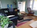 Inviting living room with a cozy rocking chair, decor and comfortable leather seating at 2867 S Oakland Dr, Shelbyville, IN 46176