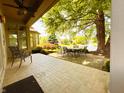 Inviting backyard patio with comfortable seating, serene pond views, and lush greenery at 5190 Pursel Ln, Carmel, IN 46033