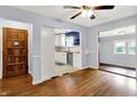 Inviting living area with hardwood floors leading to a well-lit kitchen at 5840 Brouse Ave, Indianapolis, IN 46220