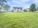 A sprawling backyard offers ample space for recreation and enjoyment at 817 Timber Creek Dr, Indianapolis, IN 46239
