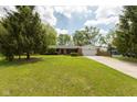 Well-kept brick ranch with attached two-car garage and expansive front yard at 8415 Los Robles Rd, Fishers, IN 46038