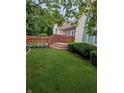 A spacious yard enclosed by a wooden fence offers plenty of room for activities at 9640 Bramblewood Way, Carmel, IN 46032