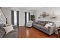 Bright and airy living room with hardwood floors, neutral paint, and stylish furniture at 9915 Wellsford Cir, Indianapolis, IN 46236