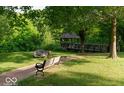 Enjoy a serene gazebo, park bench, and walking path in the lush, green community park at 1018 Cyprian Way, Lebanon, IN 46052