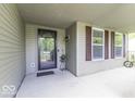Inviting covered porch featuring dark framed windows and space for decorative plants at 1119 Albemarle Cir, Noblesville, IN 46062