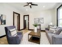A stylish living room featuring modern furniture, light wood floors and neutral walls at 1402 Olive St, Indianapolis, IN 46203