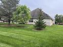 Large, well-maintained backyard with mature trees offering plenty of shade and privacy at 1604 Stonewall Dr, Greenfield, IN 46140