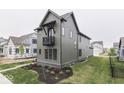 Modern farmhouse exterior featuring vertical siding and clean landscaping at 17346 Newton Main St, Westfield, IN 46074
