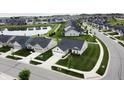 Beautiful aerial view of a neighborhood featuring well-maintained homes, a serene pond, and tree-lined streets at 17949 Scout Ln, Westfield, IN 46074