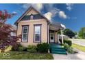 Charming two-story home with colorful landscaping, creating a welcoming entrance at 2154 Barth Ave, Indianapolis, IN 46203