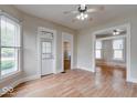 A spacious living room featuring hardwood floors, and many windows for plenty of natural light at 2154 Barth Ave, Indianapolis, IN 46203