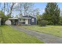 Inviting home featuring a neatly kept lawn, driveway, and charming curb appeal at 2344 N Leland Ave, Indianapolis, IN 46218