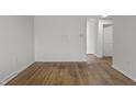 Bright living room featuring hardwood floors, neutral walls, and modern electrical outlets at 2344 N Leland Ave, Indianapolis, IN 46218