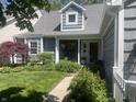 Inviting home with a charming entryway, colorful flowers, and a pathway at 3602 Bay Rd S Dr, Indianapolis, IN 46240