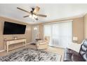 Cozy living room with neutral walls, a ceiling fan, and ample natural light at 3723 S Dearborn St, Indianapolis, IN 46237
