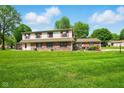 Charming two-story townhouse with a well-maintained lawn and inviting curb appeal at 4505 Stratford Dr, Anderson, IN 46013