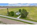 Aerial view of a home with a large lot surrounded by green fields at 5855 S 25 W, Lebanon, IN 46052