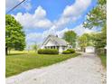 Exterior of the house with a long driveway and green foliage at 5855 S 25 W, Lebanon, IN 46052