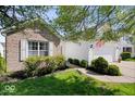 Inviting single-Gathering home with a brick accent, attached two-car garage, and manicured front yard at 5893 Crosscut Ln, Noblesville, IN 46062