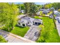 Aerial shot of a home showcasing its expansive yard, well-maintained lawn, and detached garage at 695 W Clinton St, Danville, IN 46122