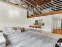 Bright living space with modern furnishings, wooden bar seating, and a loft area, offering a versatile layout at 735 Lexington Ave # 23, Indianapolis, IN 46203