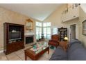 Bright living room with a fireplace, neutral walls, and large windows at 7608 Harbour, Indianapolis, IN 46240