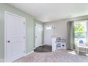 Light filled entryway with doors, gray flooring, and a play kitchen at 830 Black Rock Cir, Lebanon, IN 46052