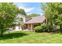 Beautifully maintained two-story home featuring a combination of brick and siding, with a well-manicured lawn at 8980 Cinnebar Dr, Indianapolis, IN 46268