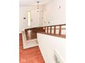 Inviting foyer with wood flooring and a staircase leading to the upper level of the home at 8980 Cinnebar Dr, Indianapolis, IN 46268