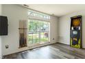 Bright bonus room with new floors, large window and an Arachnid electronic dartboard at 925 Mallory Pkwy, Franklin, IN 46131