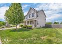 Well-maintained home featuring a lush green lawn, tidy landscaping, and a classic two-story design at 9712 Brooks Dr, McCordsville, IN 46055