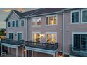 Rear exterior view showcasing the second-story balcony, siding, and outdoor space at 13094 Overview Dr # 5D, Fishers, IN 46037