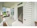 Charming front porch with a chair and a view of the well-maintained yard at 15792 Wiseman Dr, Fishers, IN 46040