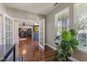 Office space featuring French doors, hardwood floors, and ample natural light from large windows at 1783 Trillium Ct, Avon, IN 46123