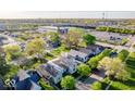 Aerial view showcasing neighborhood homes, mature trees, and access to the highway at 2221 Station St, Indianapolis, IN 46218