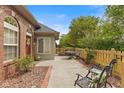 Inviting outdoor patio area with comfortable seating and a beautiful garden view, perfect for relaxation at 2726 Reflection Way, Greenwood, IN 46143