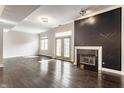 Bright open-concept living room featuring a fireplace, hardwood floors, and ample natural light at 355 E Ohio St # 314, Indianapolis, IN 46204