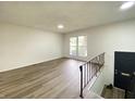 Bright living room featuring wood flooring and lots of natural light at 3640 Breen Dr, Indianapolis, IN 46235