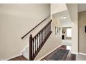 Beautiful staircase with wooden railing and carpeted steps leading to the upper level at 4602 Amesbury Pl, Westfield, IN 46062