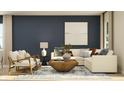 Bright and airy living room with a cozy sofa, armchairs, and a stylish coffee table on a patterned rug at 5208 Foxley Park Ln, Avon, IN 46123