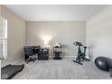 Versatile room with neutral carpet, desk, and exercise equipment offers a flexible living space at 5375 Citadel Dr, Noblesville, IN 46062