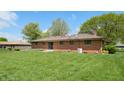 Spacious backyard with well-maintained grass, ideal for outdoor activities at 5683 Steven Dr, Greenwood, IN 46142