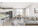Bright, open-concept space blending kitchen, dining, and living areas, featuring modern finishes and a neutral color palette at 588 Bluestem Ln, New Whiteland, IN 46184