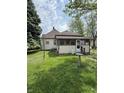 Cozy home featuring a screened-in porch and a lush backyard at 593 S 10Th S St, Noblesville, IN 46060