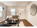 Inviting living room with hardwood floors, neutral-toned walls, and comfortable seating arrangement at 6137 Evanston Ave, Indianapolis, IN 46220